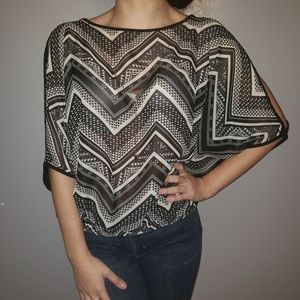 Black and White Design Blouse with a Necklace